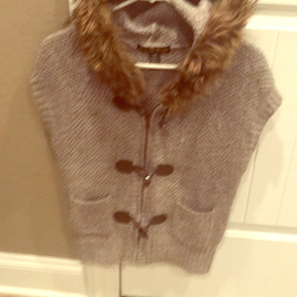 Unique sweater vest with fur hood